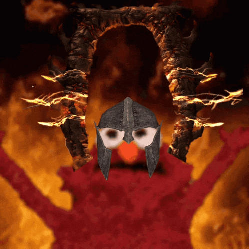 elmo wearing a helmet stands in front of a burning statue