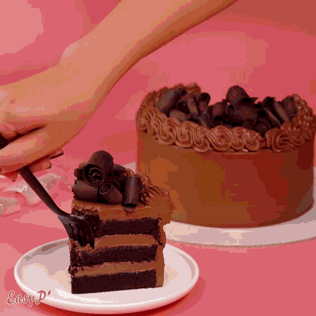 a person is cutting a slice of chocolate cake on a plate that says easy p