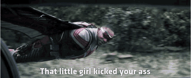 a man in a superhero suit is flying through the air with the words that little girl kicked your ass written below him