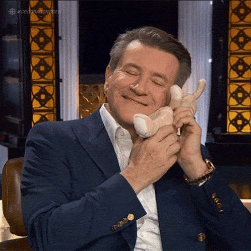 Playing With The Bunny Robert Herjavec GIF - Playing With The Bunny Robert Herjavec Dragons' Den GIFs