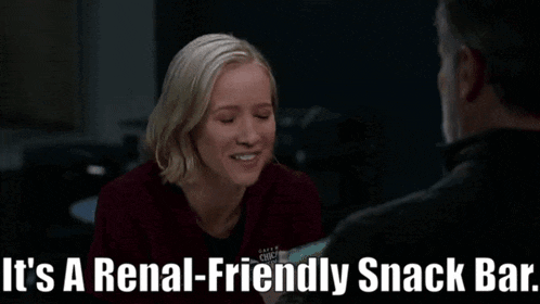 a woman is smiling while talking to a man and the words " it 's a renal-friendly snack bar " are above her