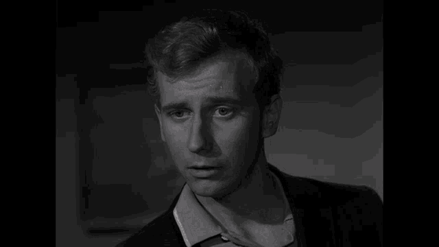 a black and white photo of a man with the words lots o ' laughs below him