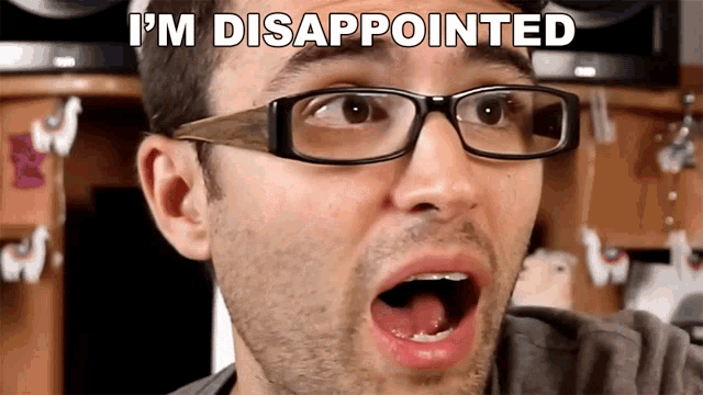 a man wearing glasses has his mouth open and the words i 'm disappointed are above him