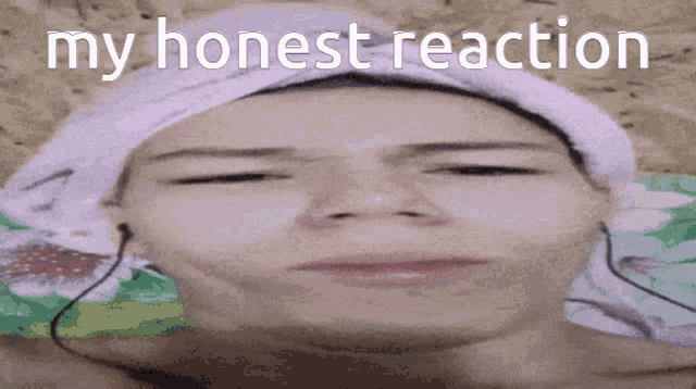 a woman with a towel wrapped around her head is making a funny face with the words my honest reaction behind her