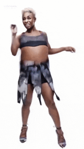 a woman with a very large belly is wearing a dress and heels