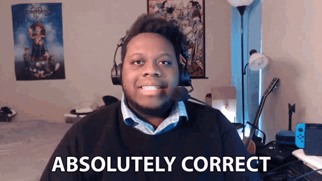 a man wearing a headset says " absolutely correct " in front of him