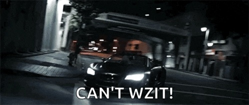 a car is driving down a street at night and the words can 't wait are written on the screen .