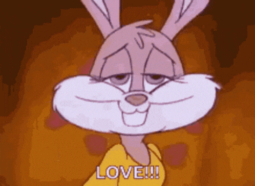 a cartoon rabbit is wearing a yellow shirt that says `` love '' .