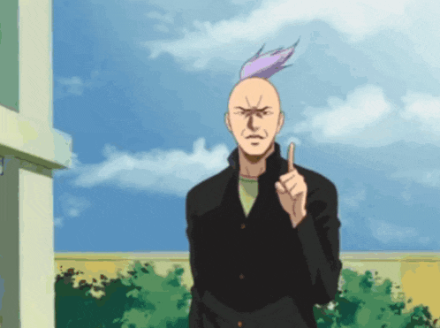 a man with a mohawk is pointing his finger