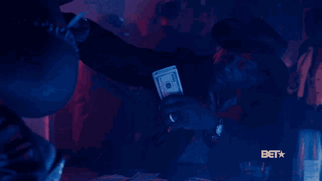 a bet logo can be seen in the corner of a dark room