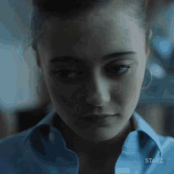 a close up of a woman 's face with the word starz on the bottom right corner .