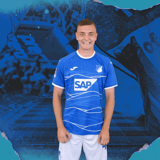 a man wearing a blue shirt that says sap