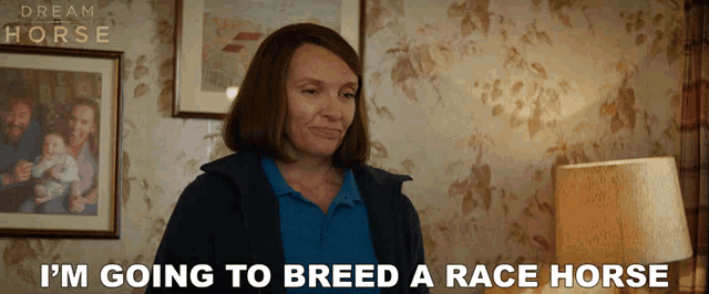 a woman says " i 'm going to breed a race horse " in front of a picture of a family