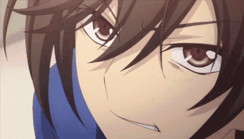 a close up of a anime character 's eyes with a blue shirt on