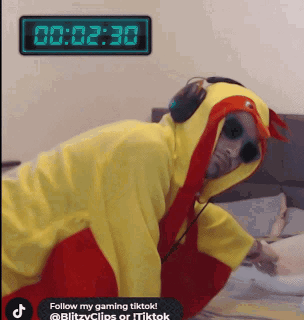 a man in a chicken costume is laying on a bed with a clock behind him that says 00 2:30