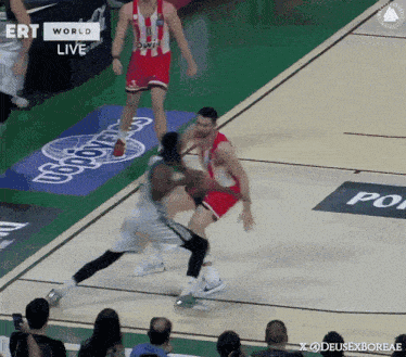 a basketball game is being played on a court sponsored by ert world
