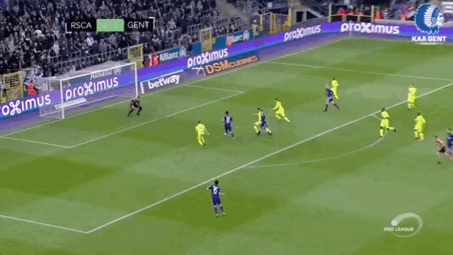 a soccer game is being played on a field with coca cola advertisements
