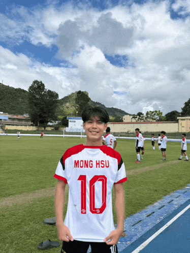 a young man wearing a jersey with the number 10 on it
