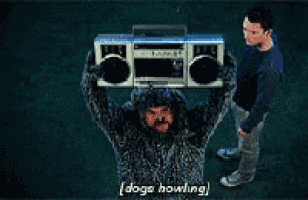 a man in a furry sweater is holding a boombox over his head and says dogs howling