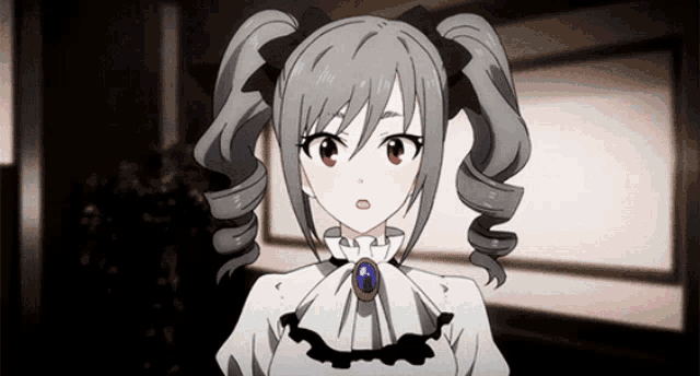 a girl with pigtails and a necklace with a blue stone on it