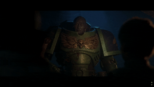 a man in a green armor with an eagle on his chest is talking to another man
