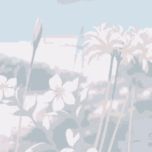 a bunch of flowers are growing in a field with a blue sky in the background