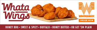 an advertisement for whata wings shows a tray of chicken wings
