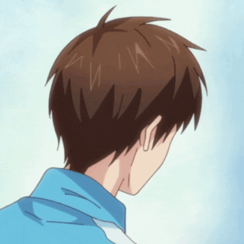 a close up of a person 's back with a blue jacket on
