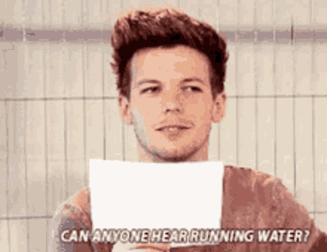 a man is holding a piece of paper in front of his face and says can anyone hear running water ?