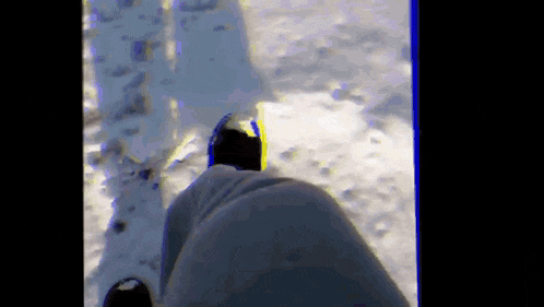 a person 's feet are shown in the snow