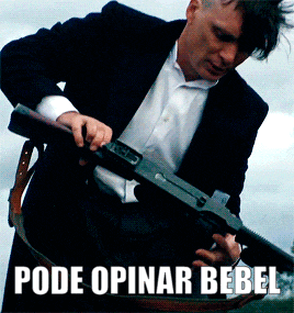 a man in a suit is holding a gun with the words pode opinar bebel above him