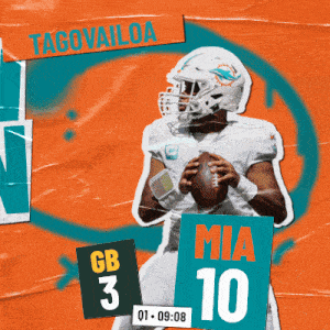 miami dolphins football player taco vailoa holds a football