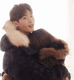 a man is carrying a woman in his arms .