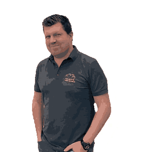 a man wearing a polo shirt with the letters fpb on the front