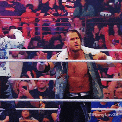 a man in a wrestling ring with tiffanyluv24 written on the bottom right