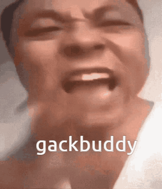 a close up of a person 's face with the words gackbuddy written on the bottom