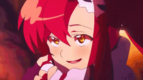 a close up of a cartoon character with red hair and yellow eyes .