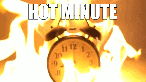 a burning alarm clock with the words hot minute written below it