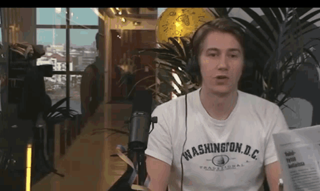 a man wearing headphones and a washington dc t-shirt