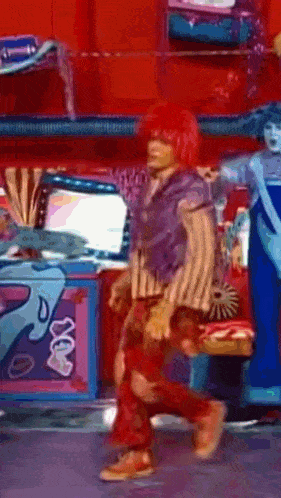 a person with red hair and a purple shirt is dancing
