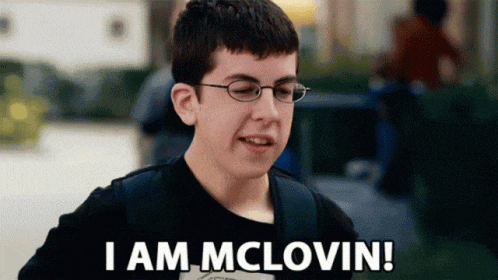 a young boy wearing glasses and a black shirt says i am mclovin