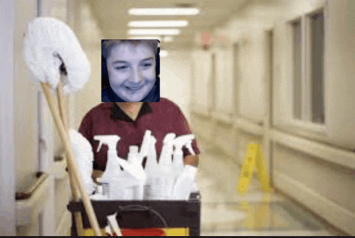 a woman carrying a cart of cleaning supplies has a picture of her face on the front of her shirt