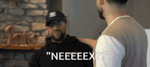 a man in a hat says " neeeeext " while talking to another man