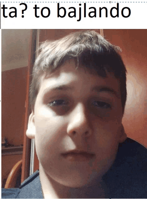 a close up of a boy 's face with the caption ta ? to bajlando