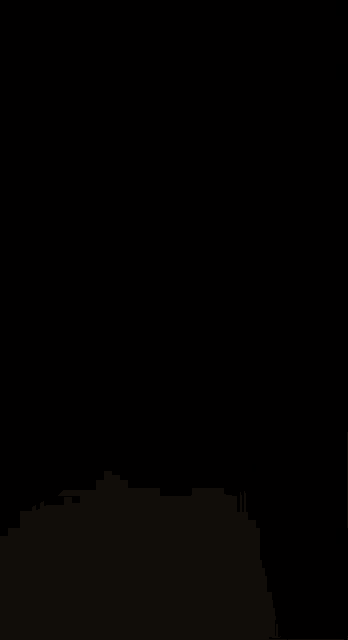 a blurred image of a person 's face with a black shirt