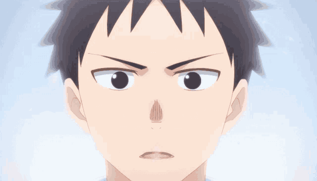 a close up of a person 's face with a serious expression