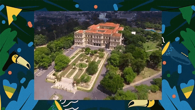an aerial view of a large building surrounded by lots of trees