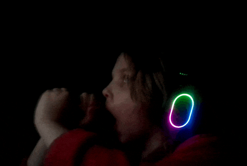 a person wearing glow in the dark headphones with a glowing circle around their ears
