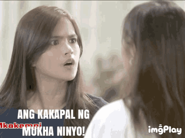 two women are looking at each other with ang ka kapal ng mukha ninyo written on the bottom