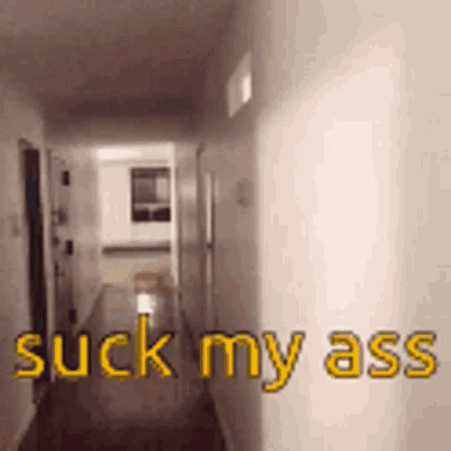 a hallway with the words suck my ass written on the wall